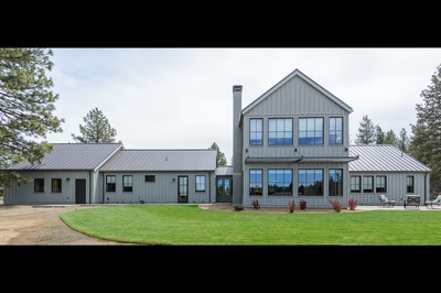 Exterior image with landscaping of Custom home in Bend Oregon built on private acreage in modern farmhouse style by Structure Development NW a home builder in Central Oregon.