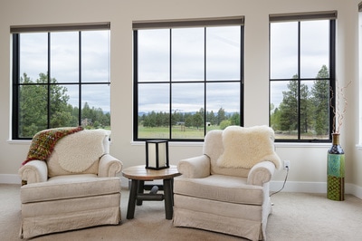 Custom interiors and large natural light windows at Custom home in Bend Oregon built on private acreage in modern farmhouse style by Structure Development NW a home builder in Central Oregon.