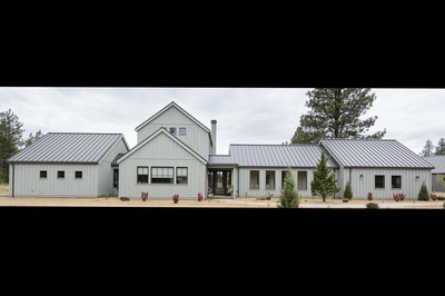 Exterior professional photo of Custom home in Bend Oregon built on private acreage in modern farmhouse style by Structure Development NW a home builder in Central Oregon.
